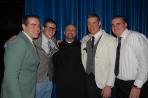 Fr. Anselm and students at the Winter Ball