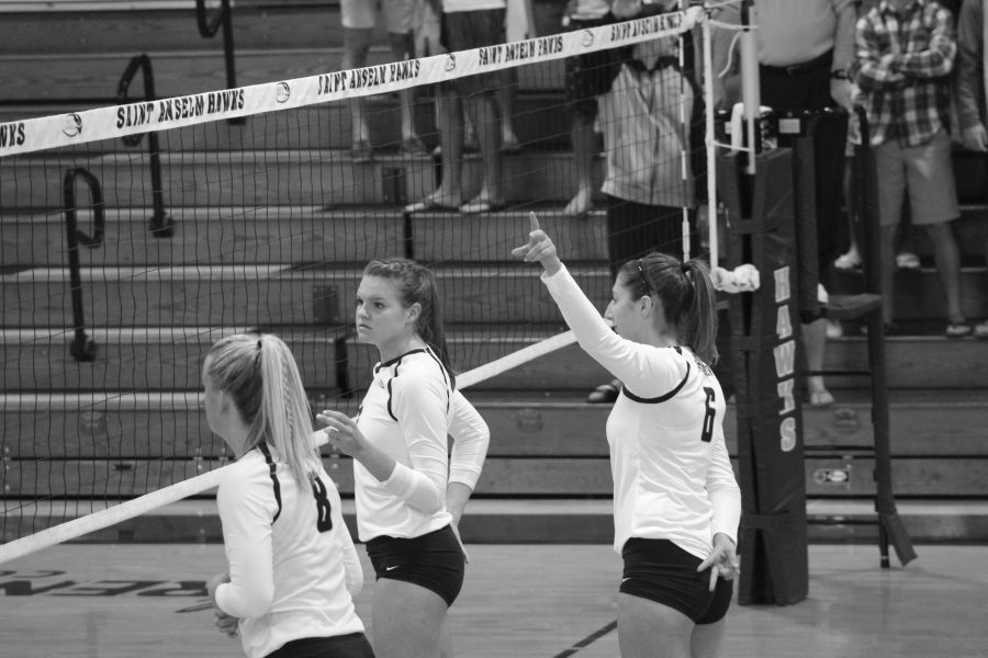 Sarah Lowery, Madison Sollows and Brennah Galdwill awaiting a serve from Pace.