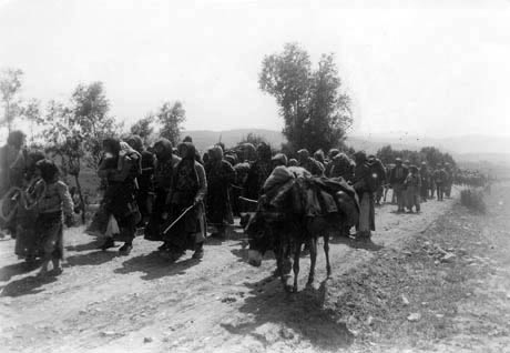 Armenian deportees leave their homes.