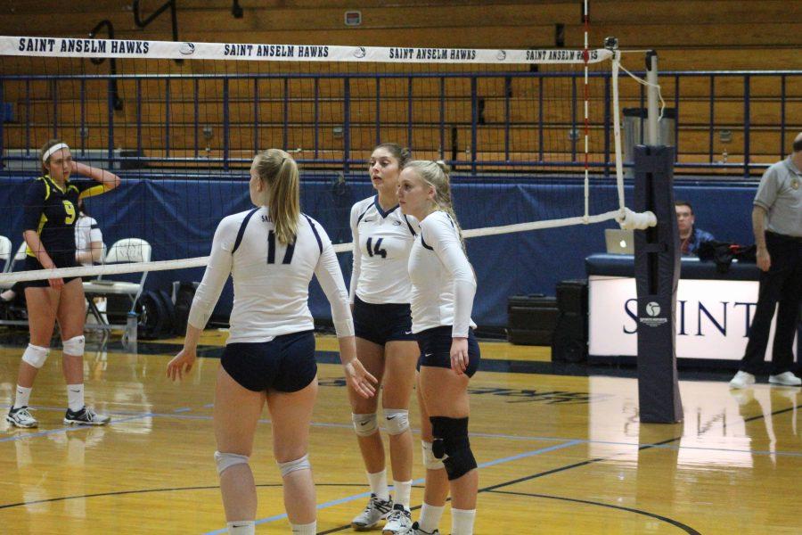 Katy Teets, Amanda Williams and Jewel Hays all waiting a serve from SNHU Oct. 4.