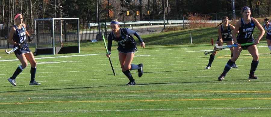 Mia Vecchione 18, Emma Kincaid 18, Elizabeth Alie 17, and Rose Mooney 17 on the field for the Hawks against Stonehill on Nov. 12.