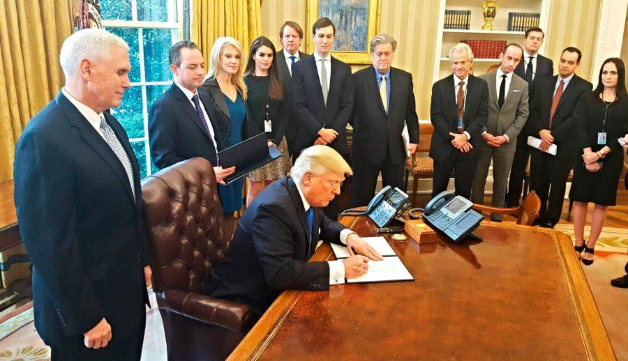 Trump signs an executive order.