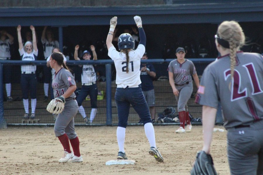 Sophomore+Jordan+O%E2%80%99Connor+looks+to+her+teammates+as+she+celebrates+her+on-base.