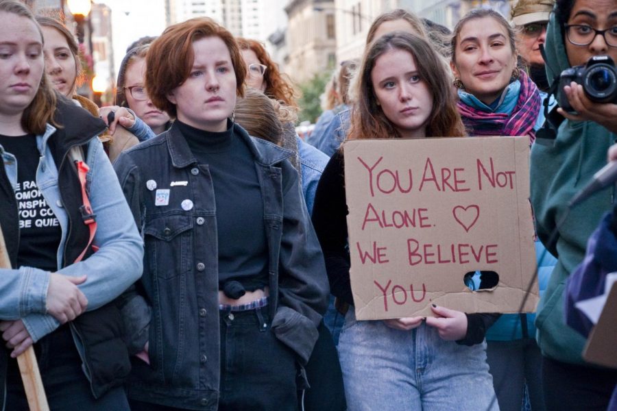 A group of young women stand in protest in Chicago, Illinois, in support of Dr. Christine Blasey Ford, saying, “You are not alone. We believe you.”