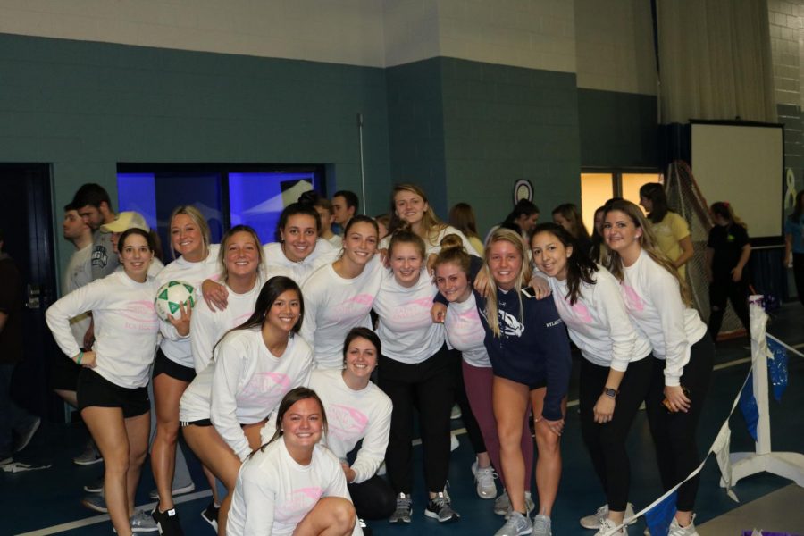 The womens ice hockey team smile as they participate in Saint Anselm Colleges 12th annual Sister Pauline Lucier Relay for Life on Friday, March 29