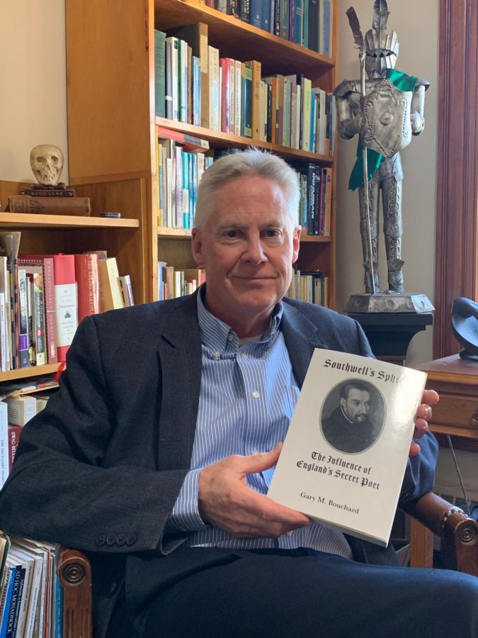 Professor Gary Bouchard of the English Department presents his copy of Southwell’s Sphere from St. Augustine’s Press. 