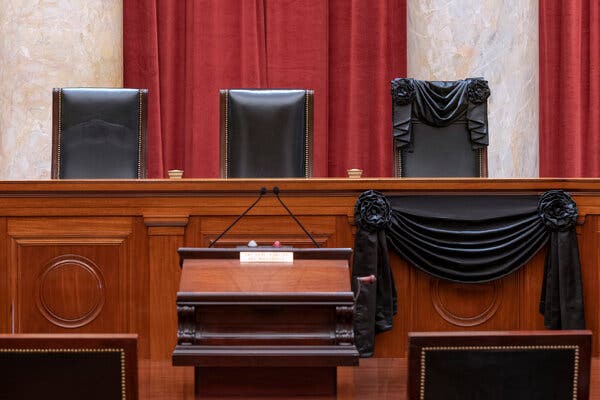 A black ribbon is draped over Justice Ginsburgs seat in the Supreme Court.