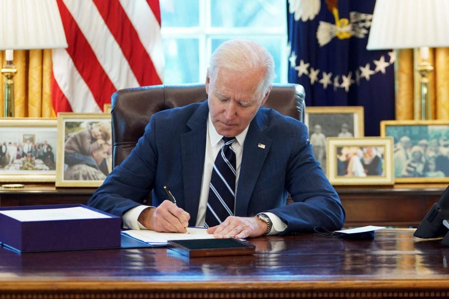 President Biden signs the Covid-19 relief package on March 11, 2021.