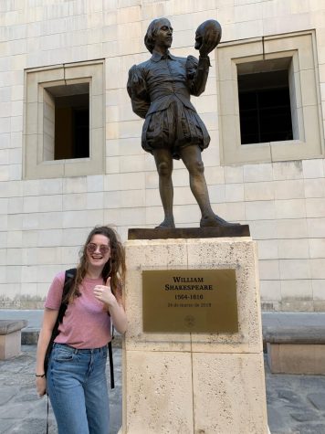Senior Stephanie Canto posing by a statue of William Shakespeare in Havana, Cuba