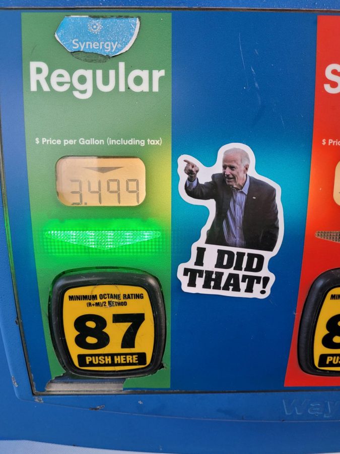 A+sticker+depicting+President+Biden+on+a+fuel+pump.+