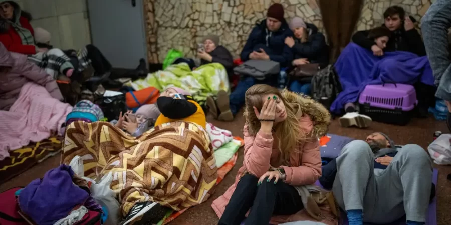 People rest in Kyiv subway, using it as a bomb shelter in Kyiv, Ukraine, Thursday, Feb. 24, 2022.
