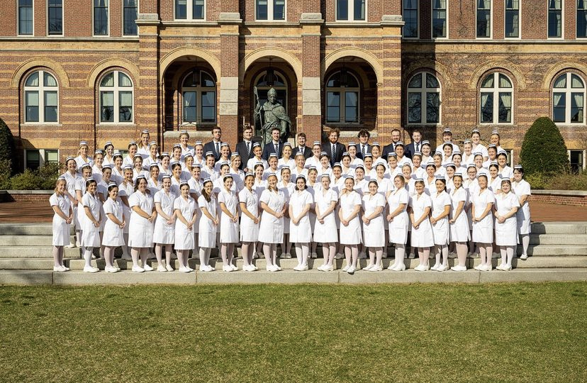 Graduating senior nursing majors gathered on the steps of Alumni Hall to celebrate the time-honored tradition of pinning