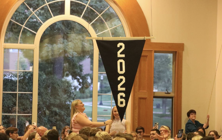 Class banner 2026 raising during orientation in Davison Hall joined by upperclassmen SGA and administration