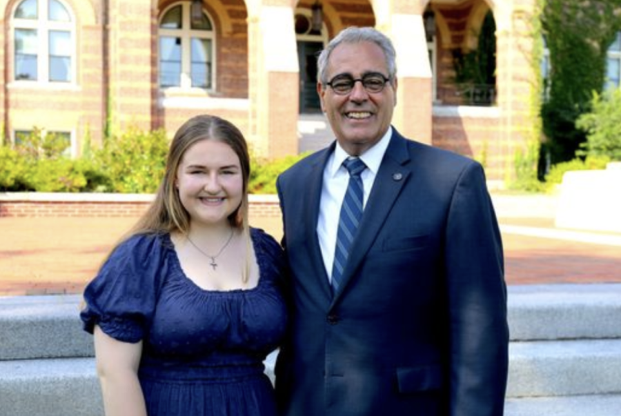Jessica Diggins ‘23 and President Favazza posing in front of Alumni Hall