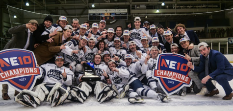 Hawks celebrate their victory over Saint Mike’s with the NE-10 championship trophy.