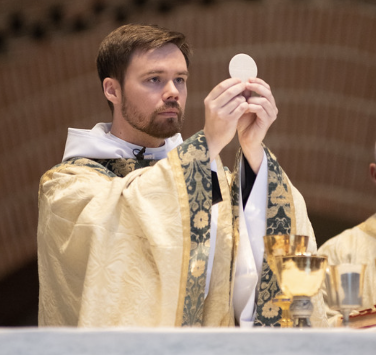Father Titus celebrates first mass as priest in the Saint Anselm Abbey Church. (Courtesy / Harkins Photography)
