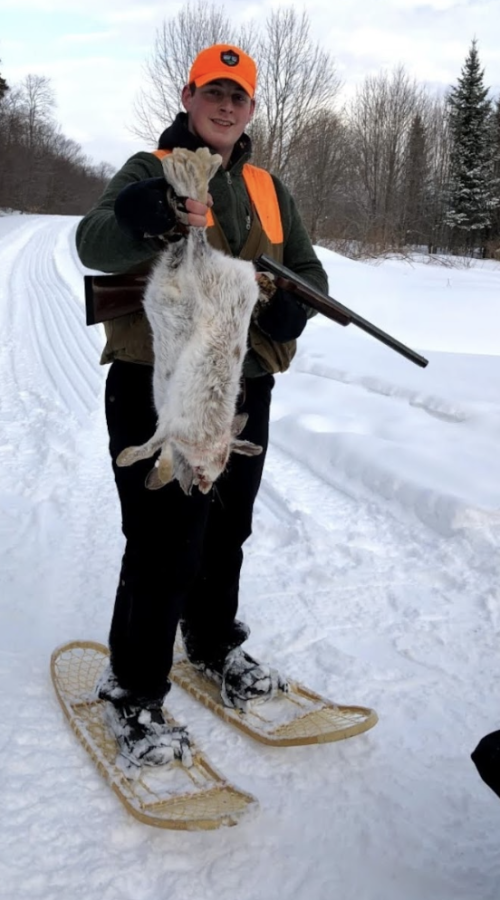 James with a snowshoe hare he shot. (Courtesy / James Lacefield) 