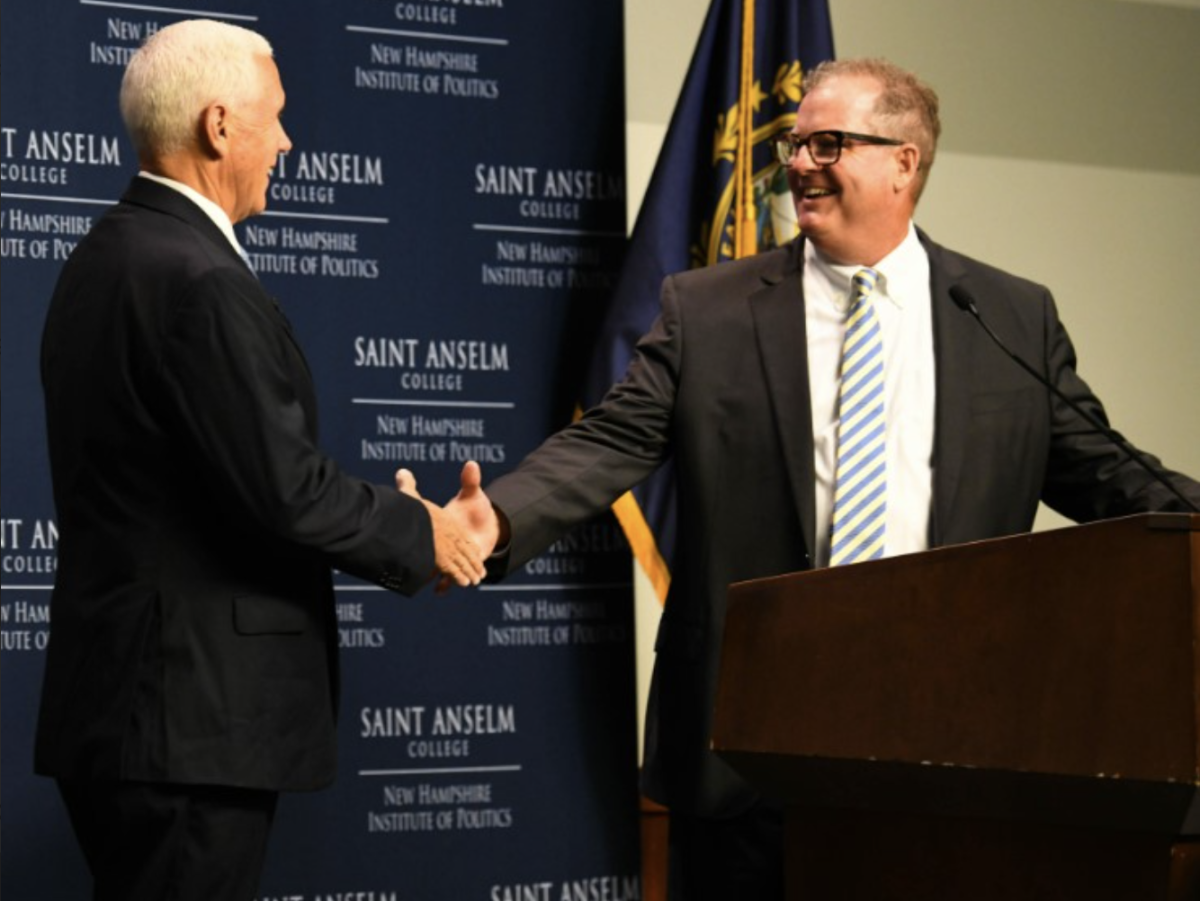 GOP candidate Mike Pence shakes hand with NHIOP Director Neil Levesque.