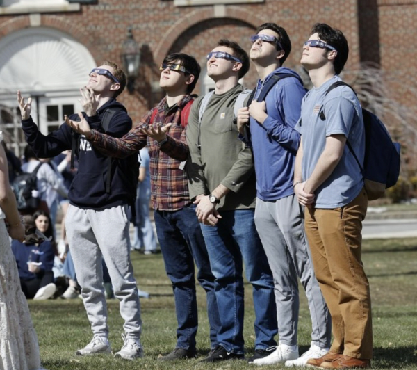 Hundreds of students gather on Alumni Quad to see the rare total solar eclipse