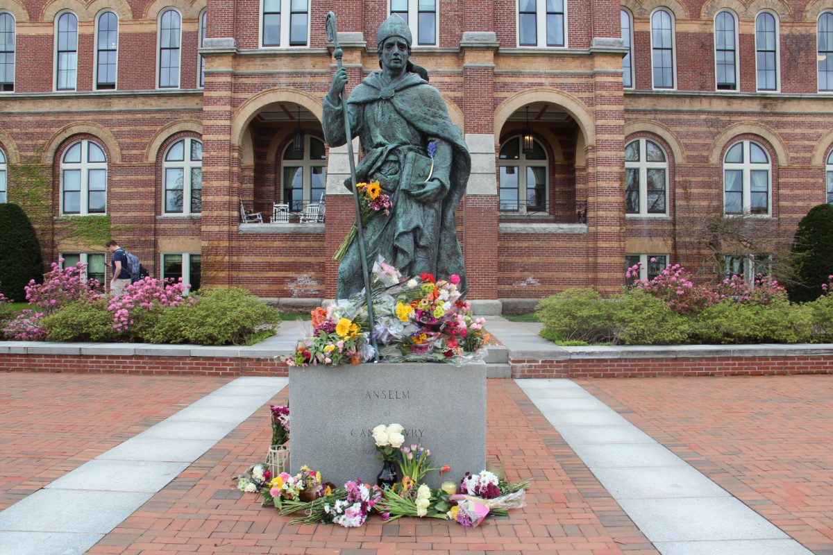 Flowers and candles were placed at the Saint Anselm statue as a memorial to Caroline Rogers 25.