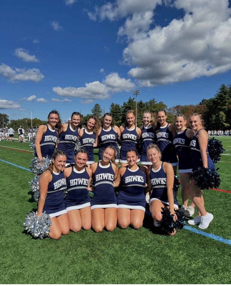  Dance team on sideline of men’s football game wearing new 2024 season uniforms.