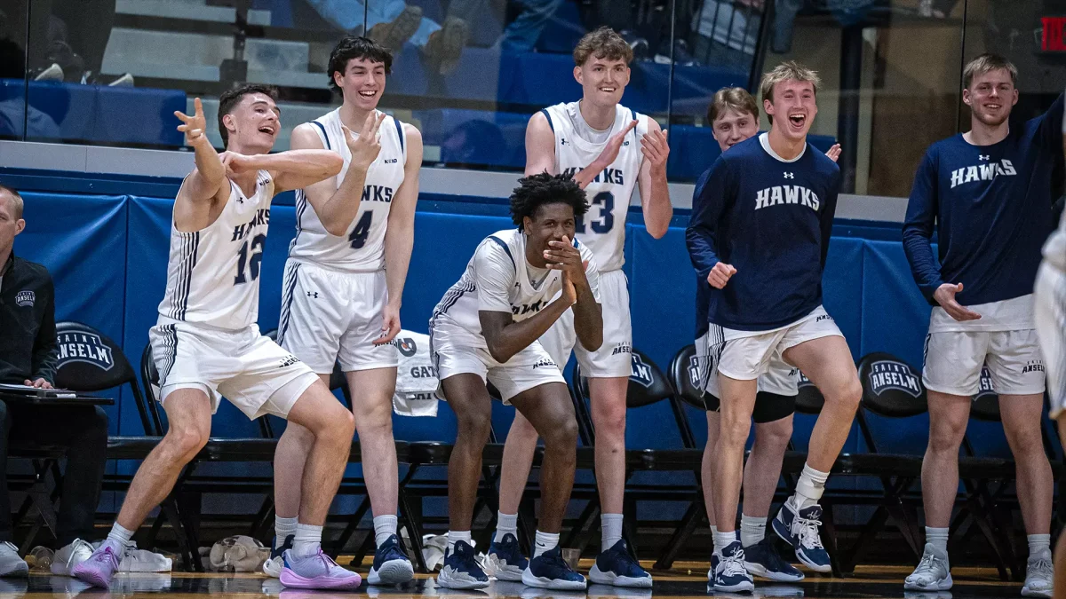  Men’s Basketball team celebrates during non-conference game against St. Thomas Aquinas.