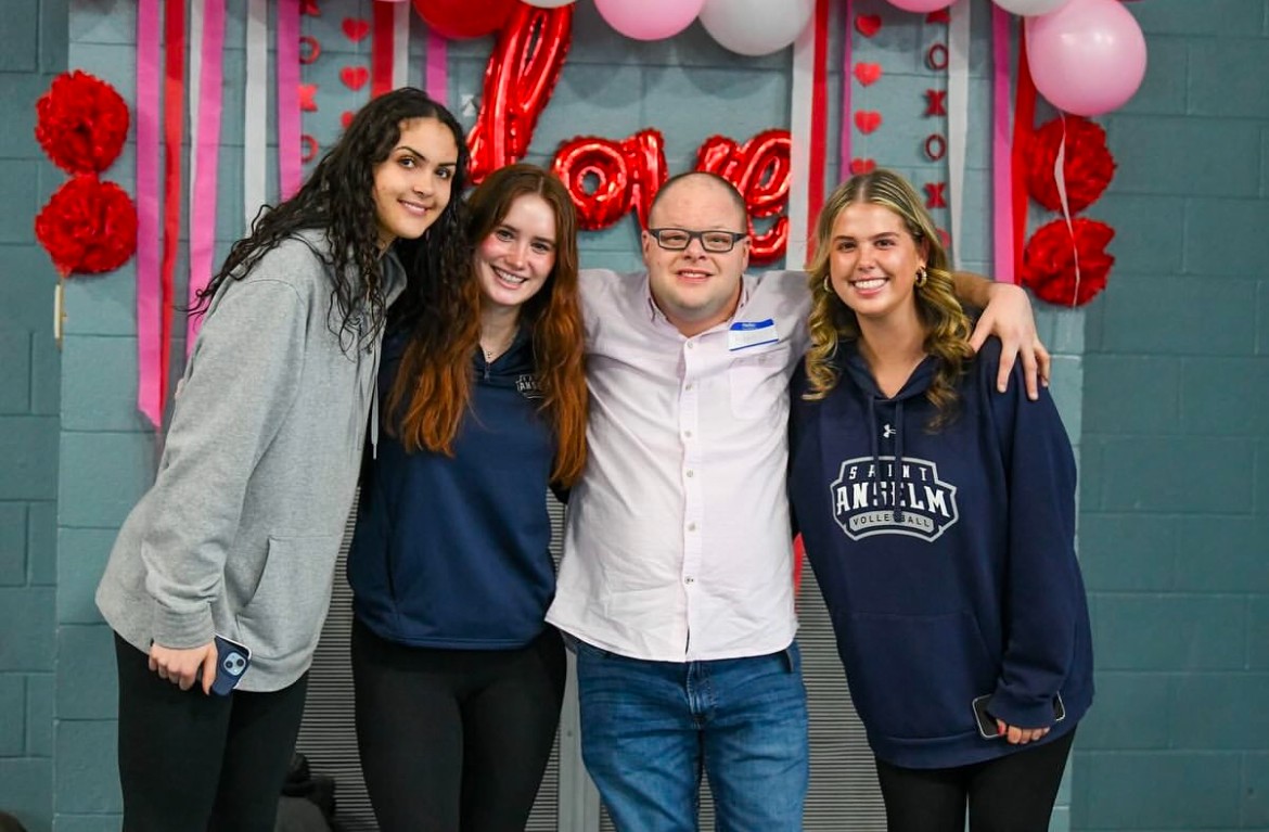  Students volunteer at dance for individuals with disabilities.